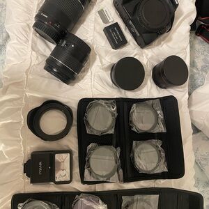 Canon EOS Rebel SL3 + zoom lens and other addons